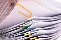 Photograph of various papers bound together by paperclips