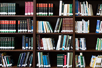 Photograph of a bookshelf with various books